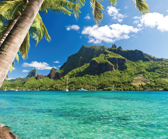 View of Moorea’s jagged mountains from the deck of a sailing catamaran