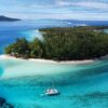 Sailing catamaran anchored near Mount Otemanu in Bora Bora