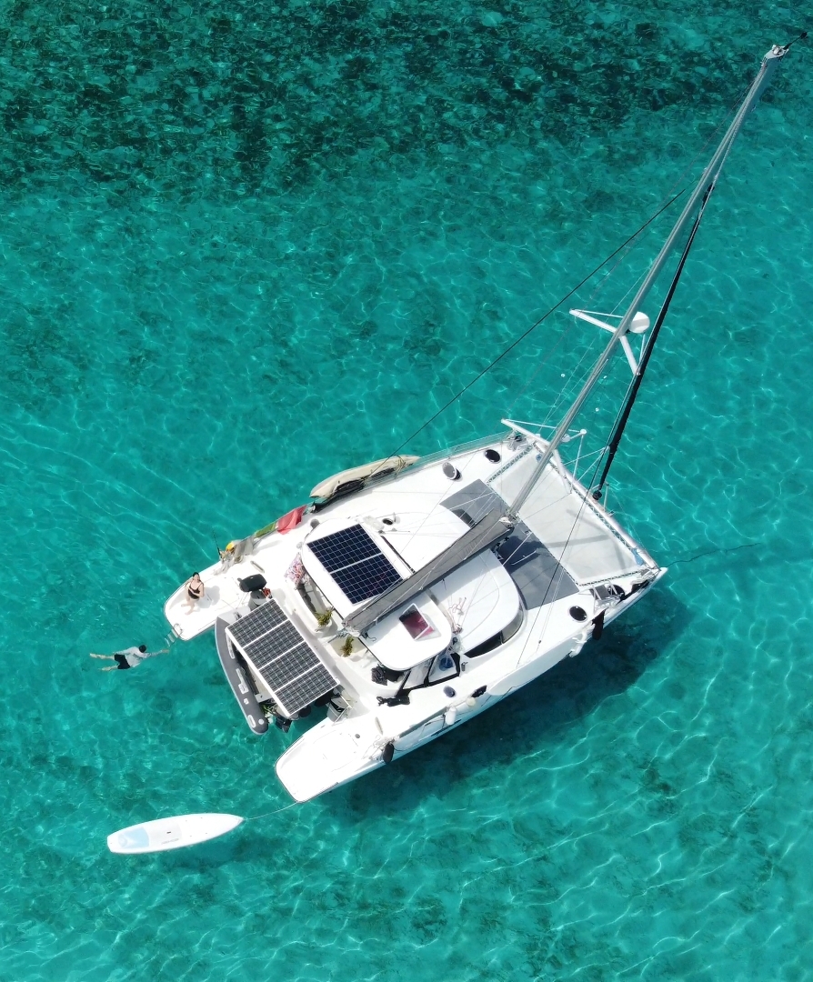 Eco-friendly catamaran with solar panels sailing in Tahiti