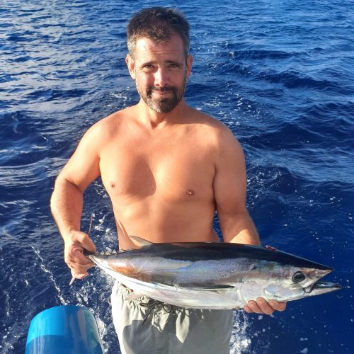 guests fishing on a catamaran in French Polynesia