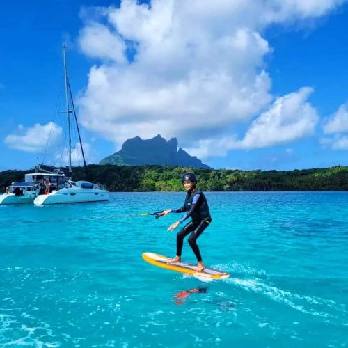 Kite surfing with dramatic mountain views