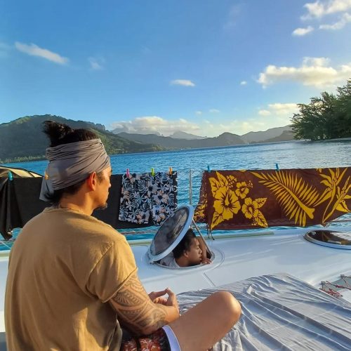 Yoga on the catamaran deck at sunrise