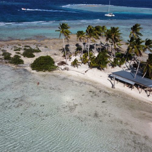 Panoramic view of a sailboat in a tropical lagoon